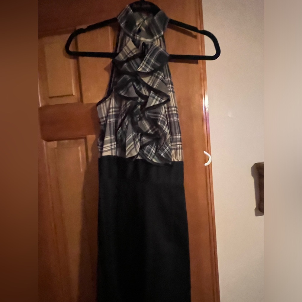Woman’s Sleeveless High Neck w ruffle top and black fitted bottom